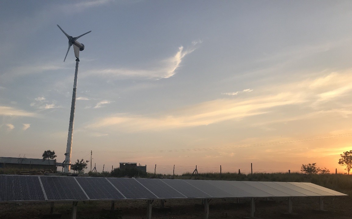 Hybrid solar/wind powerplant at sunset